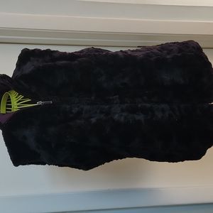 Woman's reversible black fur/purple quilted winter vest